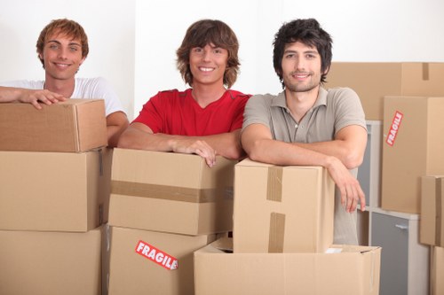 Packed moving boxes and furniture ready for a local house removal