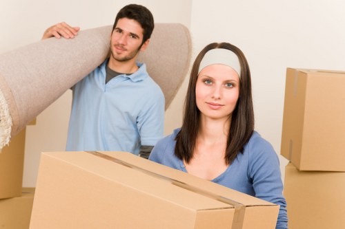 House movers managing access in a modern Leamouth apartment block